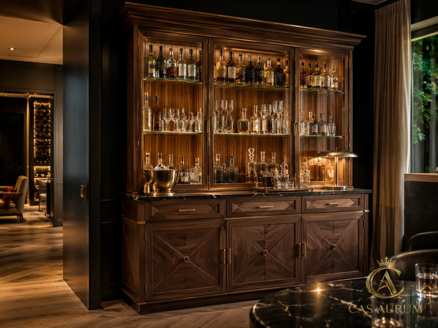 thoughtfully designed walnut and glass bar cabinet with illuminated bottle display, brass hardware and dark stone counter by CAS AURUM.